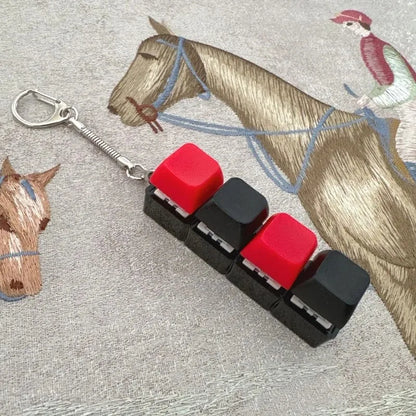 Ny Stress Ångest Lindring Tangentbord Nyckelring Fyrfingerknapp för Kontor Hem Vuxna Barn Dekompression Klicker Heta Gadget Presenter