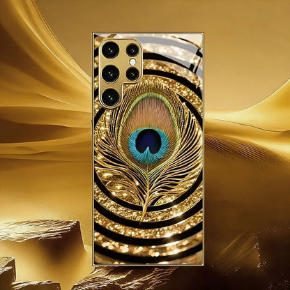 Mobilskal i härdat glas med guldplätering, kompatibelt med Galaxy S26, S25, S24, S23 och S22 Ultra Plus. Med ett mönster av guld- och blå fjädrar