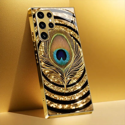 Mobilskal i härdat glas med guldplätering, kompatibelt med Galaxy S26, S25, S24, S23 och S22 Ultra Plus. Med ett mönster av guld- och blå fjädrar
